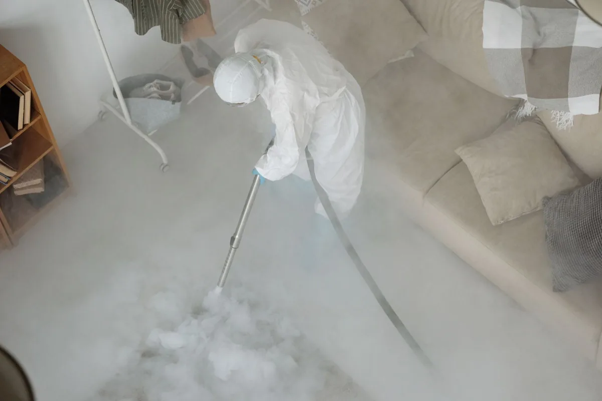 Biohazard cleanup technician in protective equipment, Olean, NY